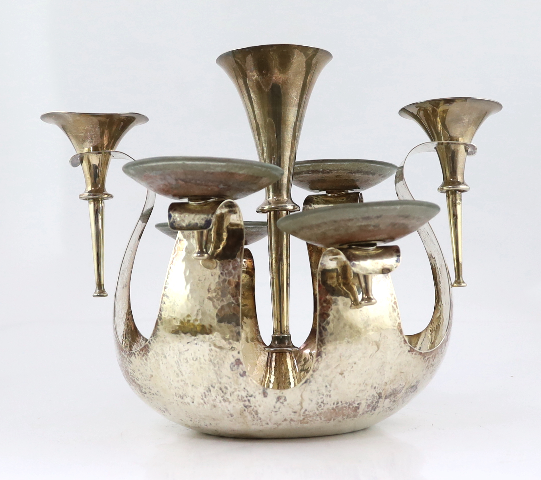 An Elizabeth II Arts & Crafts planished silver centrepiece epergne by Pruden & Smith of Ditchling, with three silver trumpet receivers and four glass dishes by Lara Aldridge